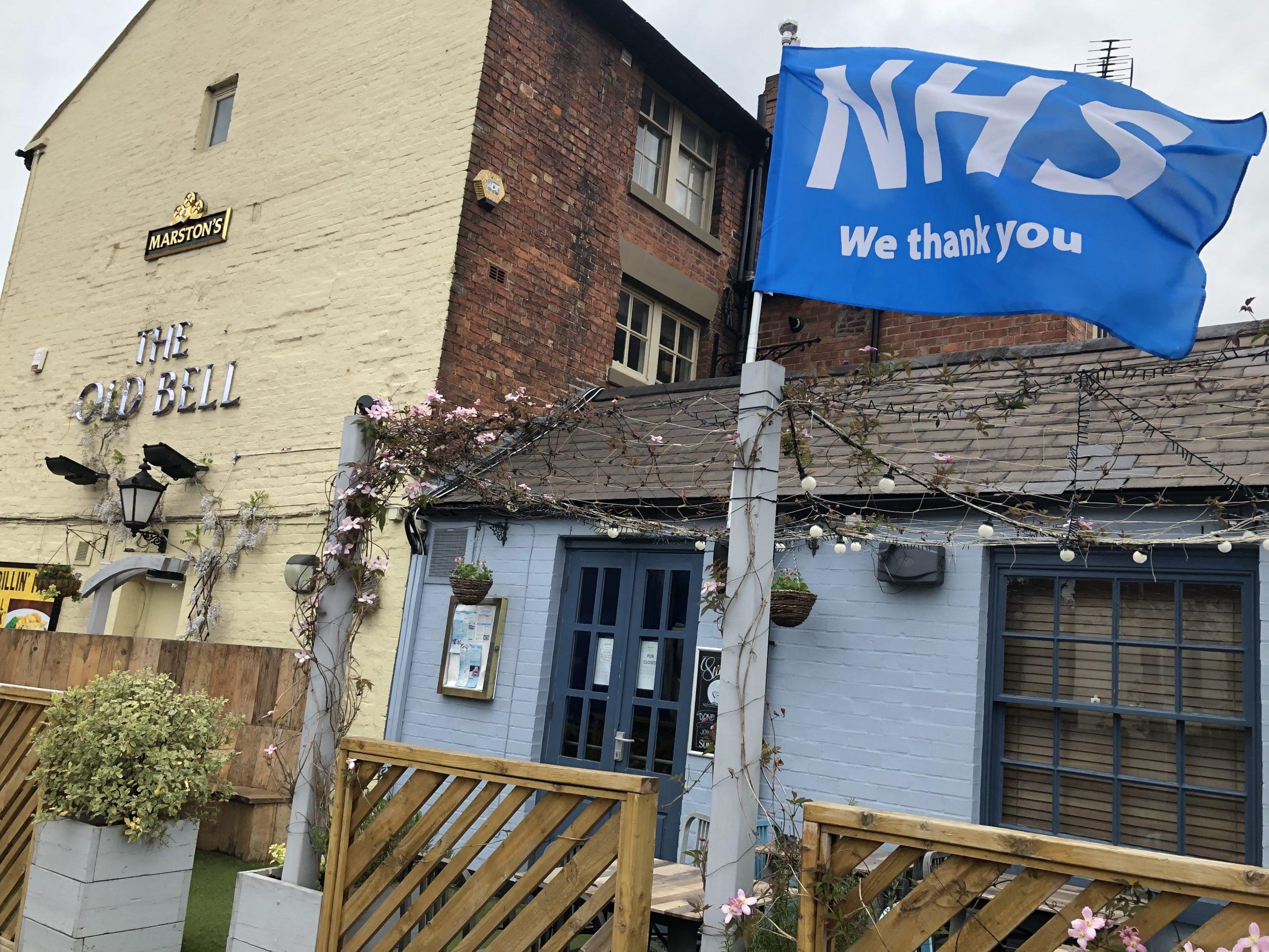 "NHS we thank you" flag outside Old Bell pub.